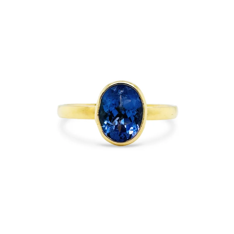 Ladies silver promise rings-Tanzanite Oval Ring In 18K Yellow Gold