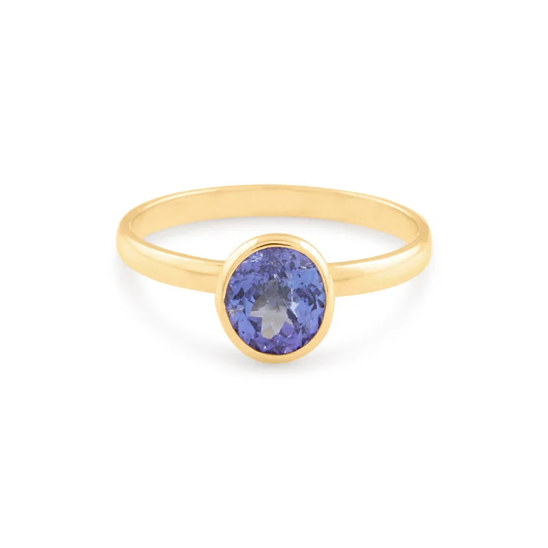 Ladies wedding rings with diamonds-Tanzanite Oval Ring In 18K Yellow Gold